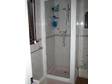 WHITE SHOWER enclosure consisting of a pivot door and....